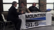 The moderator discusses the event with a local radio station.